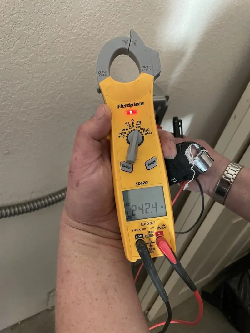 Voltage testing with clamp meter during Recessed Lighting Installation in Simpsonville